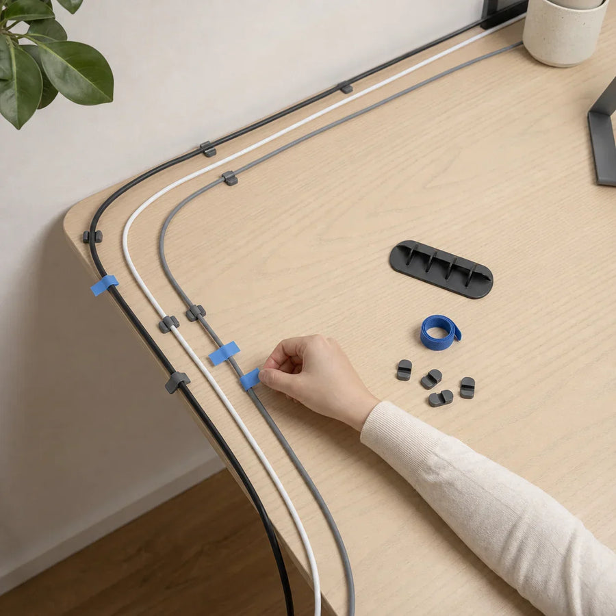 Three labeled cable paths planned along the back edge and leg of a desk without powered accessories